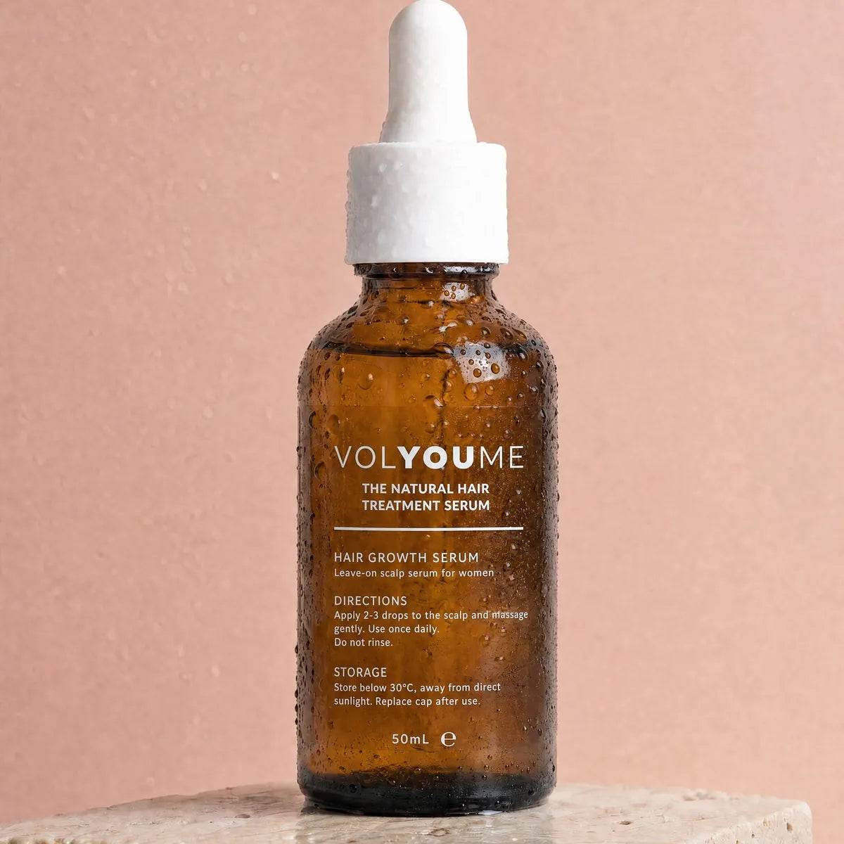 The capped serum bottle on stone